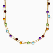 The Effy 14K Yellow Gold Multi Gemstone Station Necklace (28.93 TCW) captivates with a delicate yellow gold chain adorned with evenly spaced, colorful gemstones in red, purple, blue, green, and amber hues.