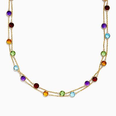 The Effy 14K Yellow Gold Multi Gemstone Station Necklace (28.93 TCW) captivates with a delicate yellow gold chain adorned with evenly spaced, colorful gemstones in red, purple, blue, green, and amber hues.