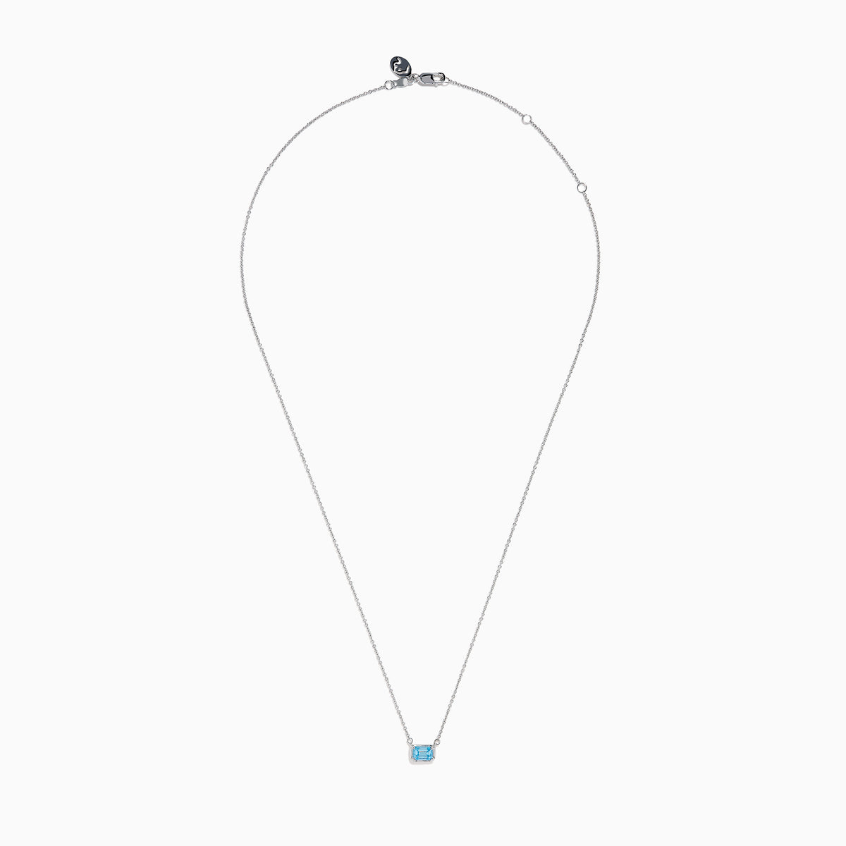 The Lab Grown Blue Diamond Necklace in 14K White Gold features a rectangular emerald-cut lab-grown blue diamond pendant in a simple bezel setting on a delicate white gold chain.