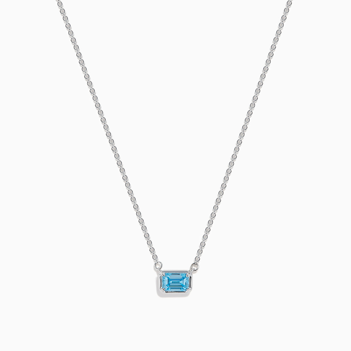 The Lab Grown Blue Diamond Necklace in 14K White Gold features a rectangular emerald-cut lab-grown blue diamond pendant in a simple bezel setting on a delicate white gold chain.
