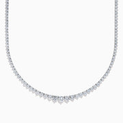 A close-up of the Lab Grown Round Diamond 12.00ct Graduated Tennis Necklace in 14K White Gold, showcasing a continuous row of sparkling lab grown diamonds against a white background.