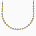 The Canare 18K Two Tone Gold White and Yellow Diamond Necklace showcases square yellow diamonds, each framed by small white diamonds, evenly set along the chain for a refined two-tone gold effect.