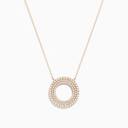 The Pave Rose 14K Rose Gold Diamond Circle Necklace showcases a circular pendant with two concentric rows of sparkling diamonds, shown on a white background.