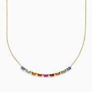 The Watercolors 14K Yellow Gold Multi Sapphire and Diamond Necklace features a delicate gold chain with a gradient row of rectangular multicolored sapphires and diamond accents, displayed on a white background.