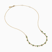The 14K Yellow Gold Emerald and Diamond Bezel Set Station Necklace features alternating round emeralds and diamonds in bezel settings, evenly spaced along the front curve of the chain, displayed on a white background.