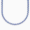 A close-up of the Nahla 14K White Gold Tanzanite and Diamond Necklace, showcasing pear-shaped blue tanzanites and sparkling diamonds set in a symmetrical design against a white background.