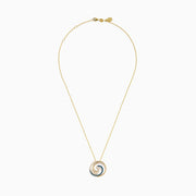 This 14 Karat Yellow Gold Blue Diamond Swirl Pendant features alternating rows of blue and clear gemstones in a spiral swirl, with an elegant wave-like design on a delicate chain.