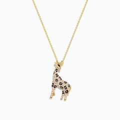 The Safari 14K Yellow Gold Espresso & White Diamond Giraffe Pendant, 0.43 TCW, features black, white, and brown sparkling crystals on a delicate gold chain, shown against a white background.