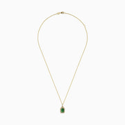 The Brasilica 14K Yellow Gold Emerald & Diamond Pendant, 1.62 TWC, features a rectangular emerald framed by sparkling diamonds on a gold chain, shown against a white background.