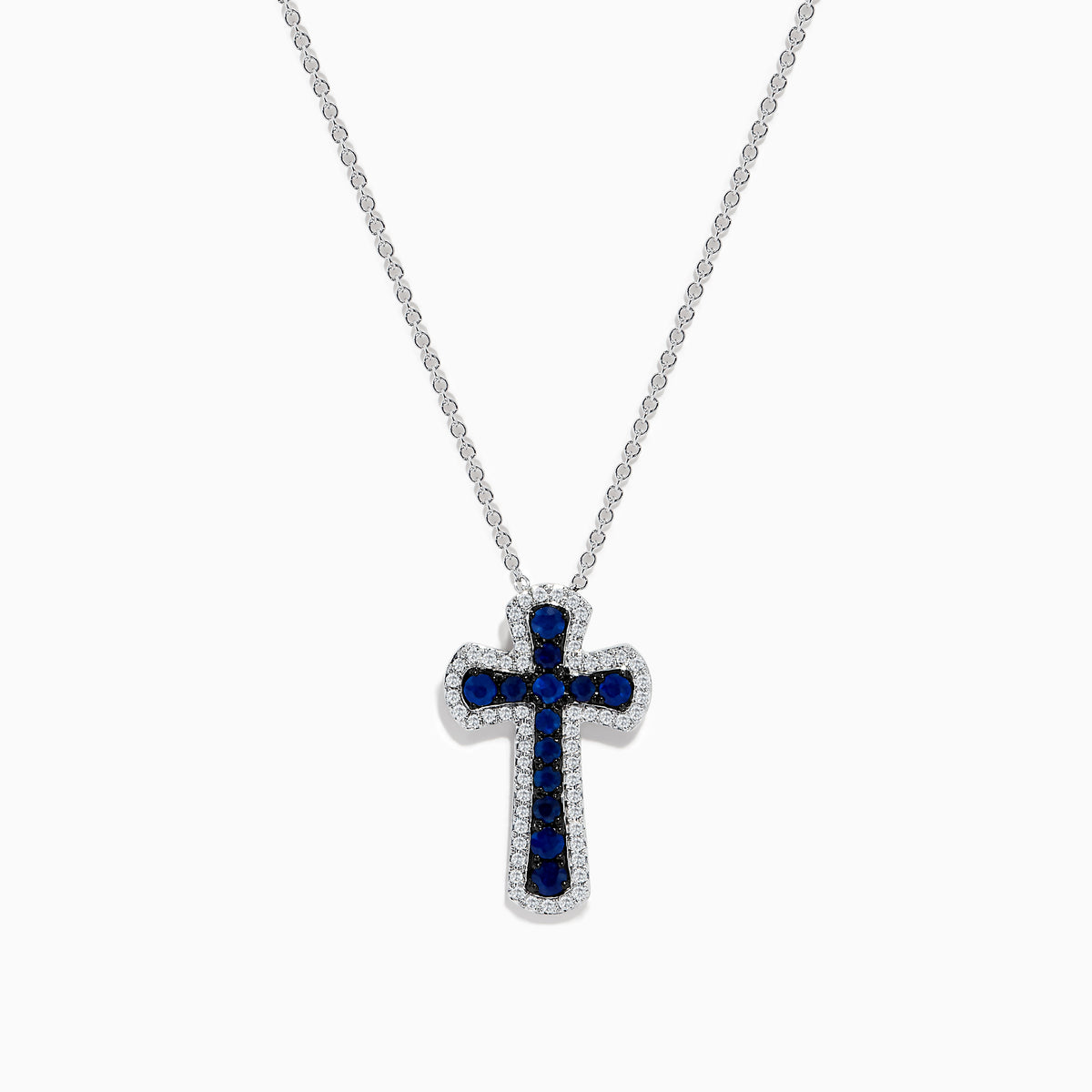 A 14K white gold cross pendant featuring blue sapphires and sparkling diamonds, totaling 0.91 carats—an elegant touch for any jewelry collection.