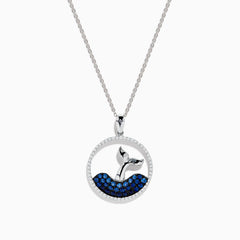 The Seaside 14K White Gold Sapphire and Diamond Whales Tail Pendant features a circular design with a whale tail emerging from sapphire-studded waves, bordered by sparkling diamonds.
