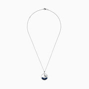 The Seaside 14K White Gold Sapphire and Diamond Whales Tail Pendant features a circular design with a whale tail emerging from sapphire-studded waves, bordered by sparkling diamonds.