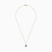 The 14K Yellow Gold Blue and White Diamond Halo Pendant features a round blue gemstone centerpiece surrounded by sparkling white diamonds, all set on a delicate fine chain.