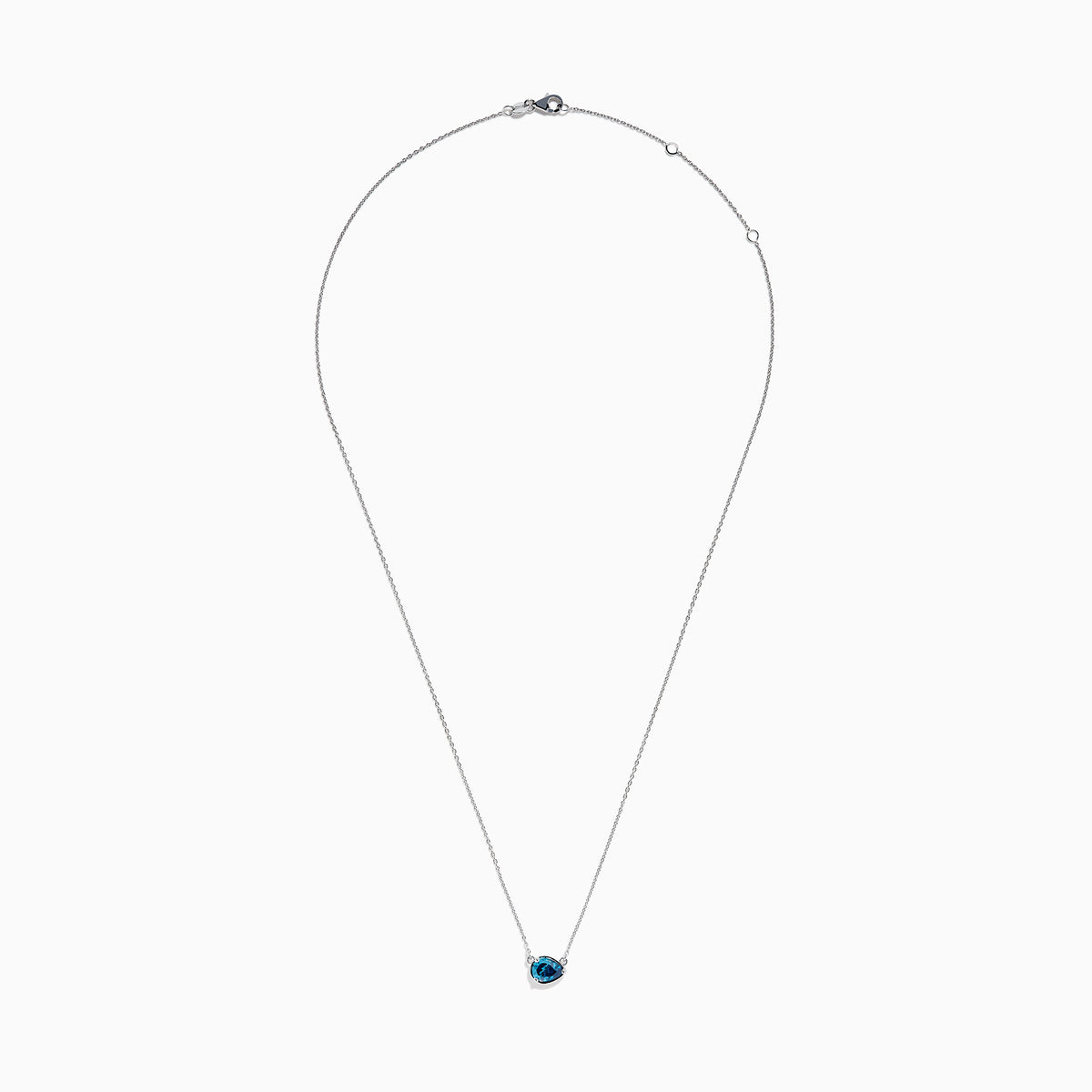 The 14K White Gold Pear Shaped Blue Diamond Necklace features a pear-cut blue diamond pendant in a minimalist setting, crafted from 14K white gold and showcased on a white background.