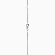 The 14K White Gold Pear Shaped Blue Diamond Necklace features a pear-cut blue diamond pendant in a minimalist setting, crafted from 14K white gold and showcased on a white background.