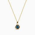 The 14K Yellow Gold Blue Diamond Cushion Pendant features a hexagonal pendant with a deep blue gemstone, set on a yellow gold chain and displayed against a white background.