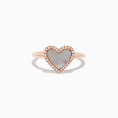The 14K Rose Gold Mother of Pearl and Diamond Heart Ring features a heart-shaped mother-of-pearl centerpiece framed by sparkling diamonds.