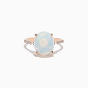 The Aurora 14K Rose Gold Opal and Diamond Ring features an oval iridescent opal center, accented by small round diamonds on the band, displayed against a white background.