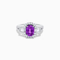 The Effy Hematian 18K White Gold Purple Sapphire and Diamond Ring showcases a large oval purple sapphire encircled by a diamond halo, with extra diamonds accenting the split shank, all set against a white background.