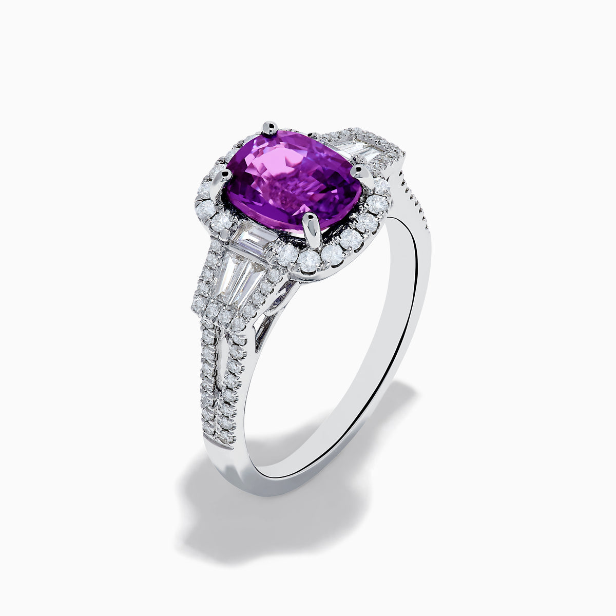 The Effy Hematian 18K White Gold Purple Sapphire and Diamond Ring showcases a large oval purple sapphire encircled by a diamond halo, with extra diamonds accenting the split shank, all set against a white background.
