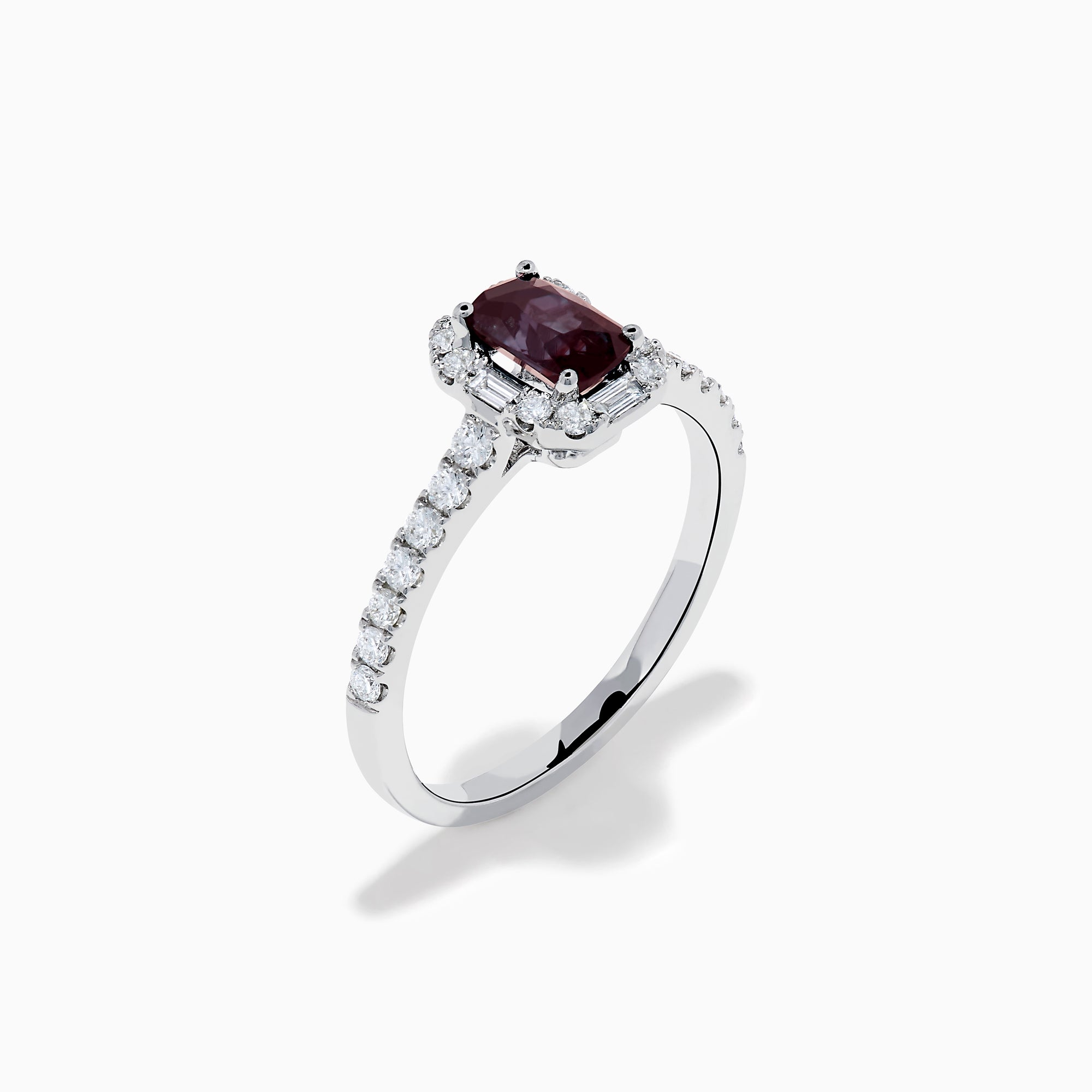 The Effy Hematian 14K White Gold Ring features a cushion-cut alexandrite center stone, surrounded by a diamond halo and additional diamonds set along the band.