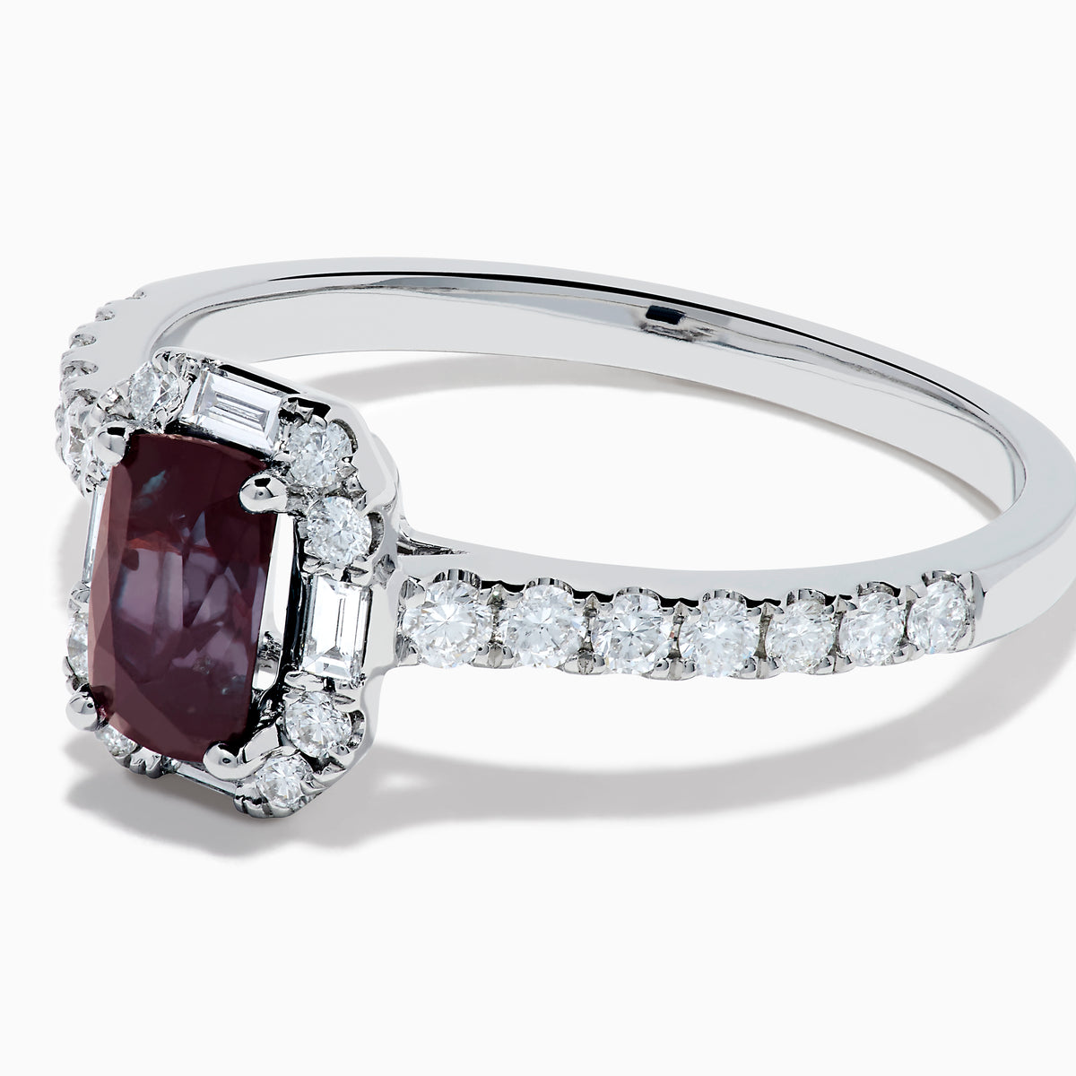 The Effy Hematian 14K White Gold Ring features a cushion-cut alexandrite center stone, surrounded by a diamond halo and additional diamonds set along the band.