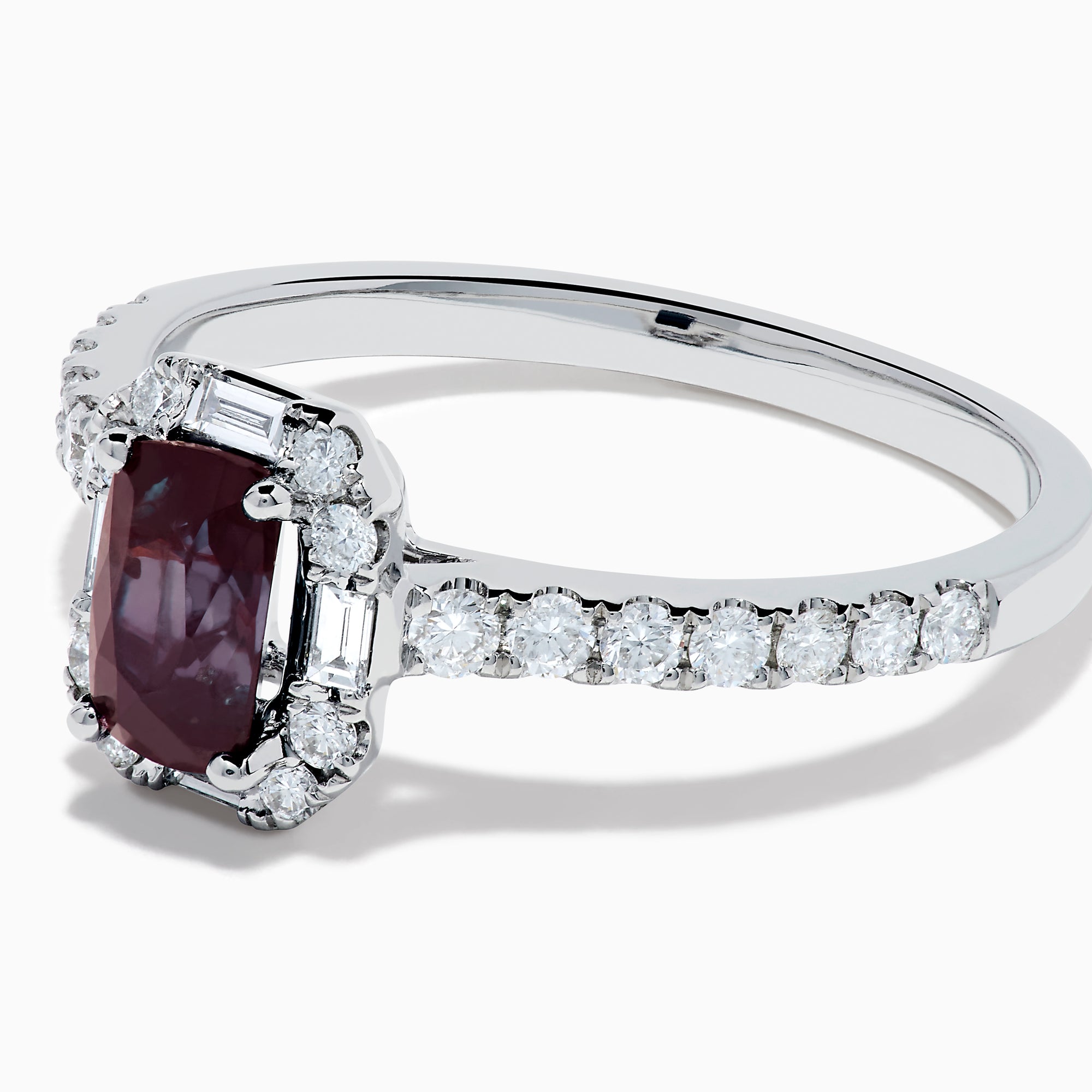 The Effy Hematian 14K White Gold Ring features a cushion-cut alexandrite center stone, surrounded by a diamond halo and additional diamonds set along the band.