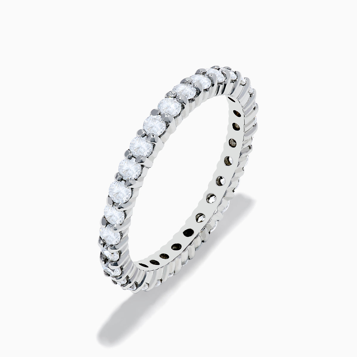 The 14K White Gold Prong Set Diamond Eternity Band, 1.00 TCW, showcases a continuous row of round white diamonds in a prong set design, shown on a white background.