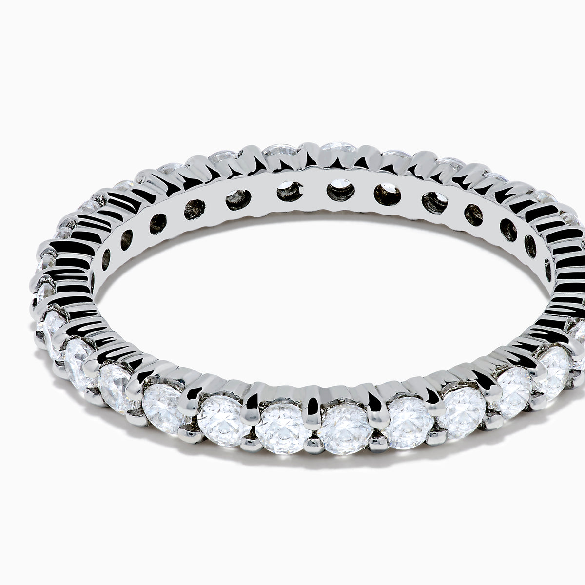 The 14K White Gold Prong Set Diamond Eternity Band, 1.00 TCW, showcases a continuous row of round white diamonds in a prong set design, shown on a white background.