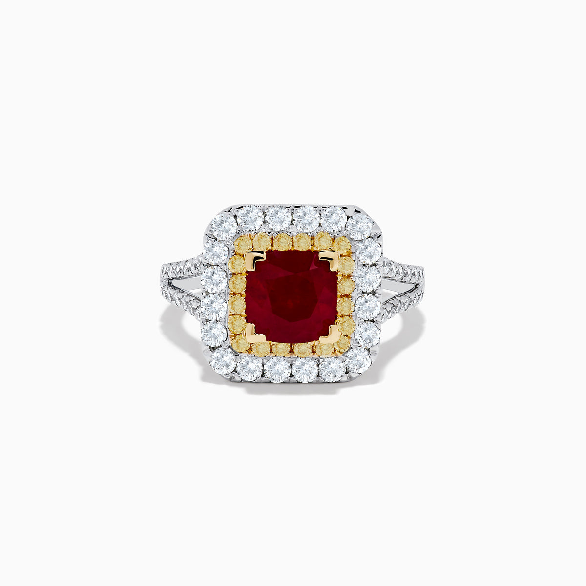 The 18K 2-Tone Gold Ruby, Yellow and White Diamond Double Halo Ring features a square ruby center, surrounded by yellow and white diamonds, set on a silver band with diamond accents.
