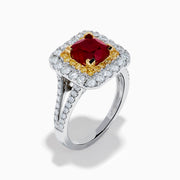 The 18K 2-Tone Gold Ruby, Yellow and White Diamond Double Halo Ring features a square ruby center, surrounded by yellow and white diamonds, set on a silver band with diamond accents.