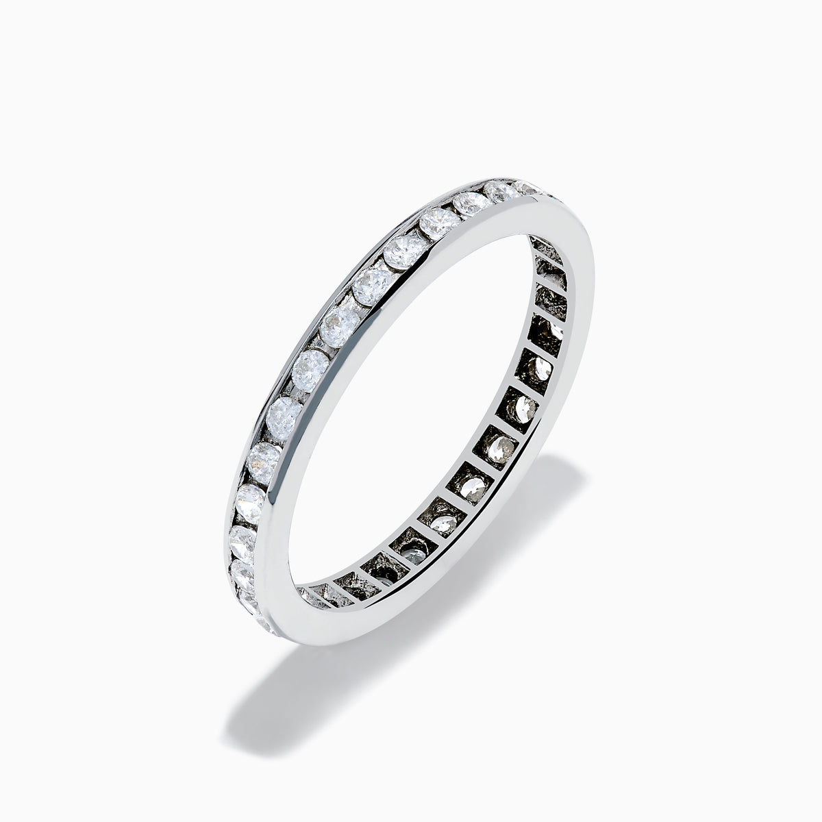 The 14K White Gold Channel Set Diamond Eternity Band, 0.50 TCW, features round diamonds in a continuous channel setting encircling the band, shown on a white background.