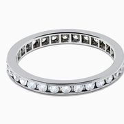 The 14K White Gold Channel Set Diamond Eternity Band, 0.50 TCW, features round diamonds in a continuous channel setting encircling the band, shown on a white background.