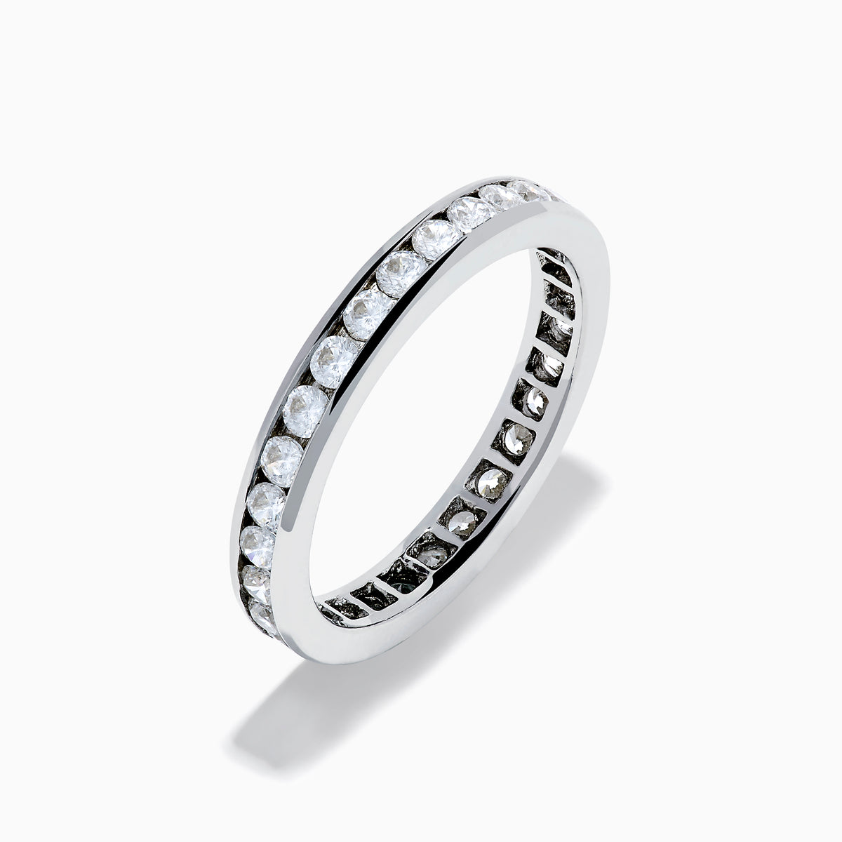 The 14K White Gold Channel Set Diamond Eternity Band, 1.00 TCW, showcases a seamless row of round diamonds in a channel setting for elegant sparkle against polished white gold.