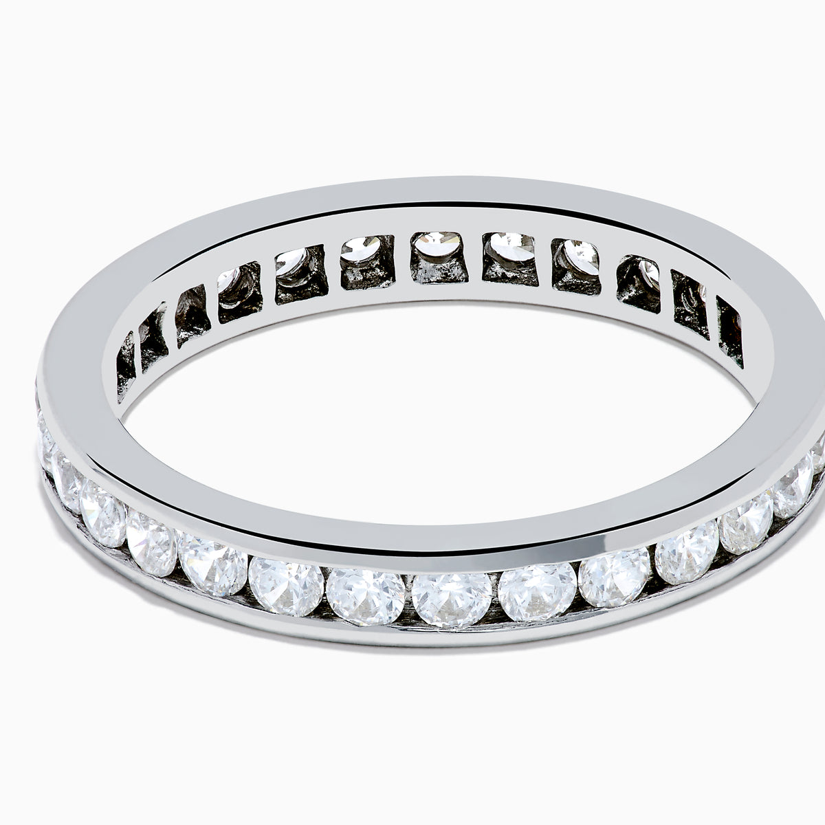 The 14K White Gold Channel Set Diamond Eternity Band, 1.00 TCW, showcases a seamless row of round diamonds in a channel setting for elegant sparkle against polished white gold.