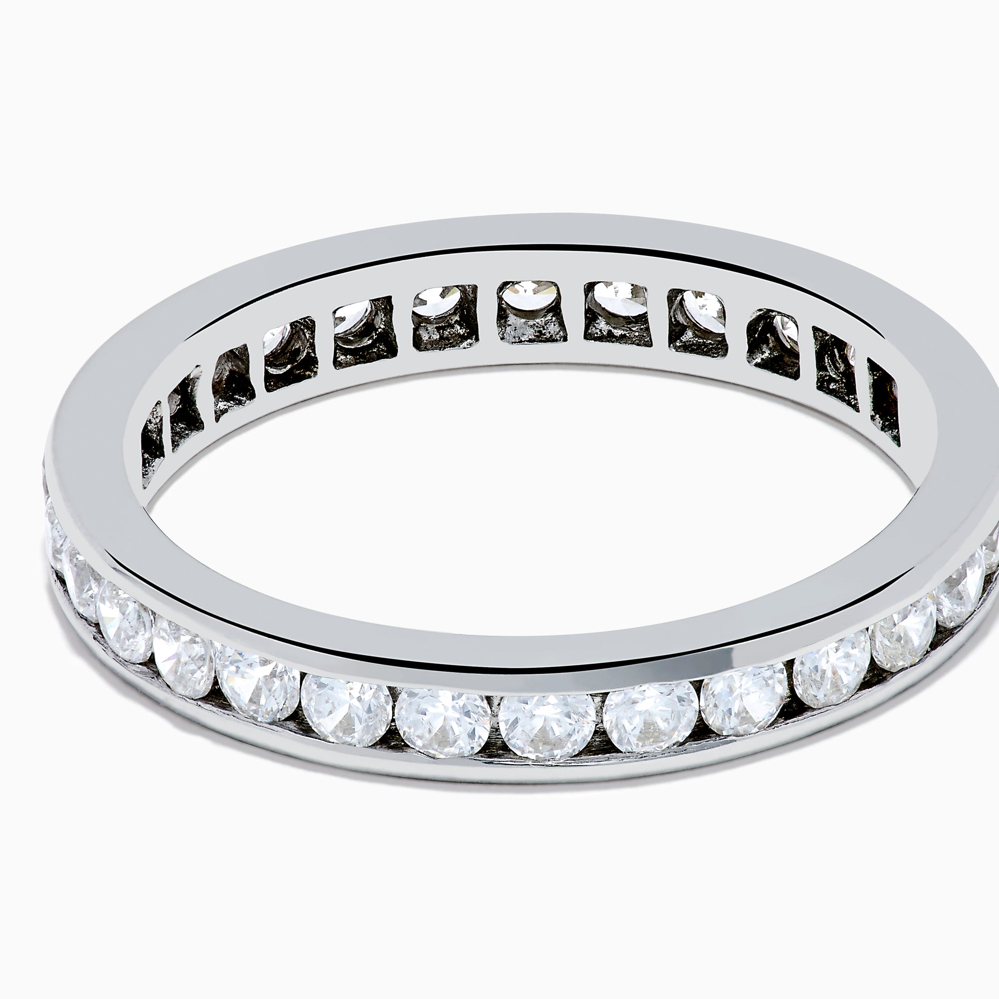 The 14K White Gold Channel Set Diamond Eternity Band, 1.00 TCW, showcases a seamless row of round diamonds in a channel setting for elegant sparkle against polished white gold.