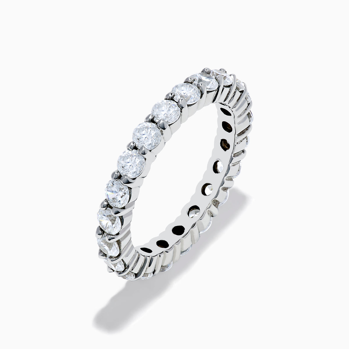 The 14K White Gold Prong Set Diamond Eternity Band, 2.00 TCW, features round clear diamonds encircling the ring and is displayed on a plain white background.