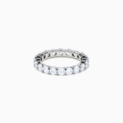 The 14K White Gold Prong Set Diamond Eternity Band, 3.00 TCW, features round diamonds encircling the band and is shown on a plain white background.