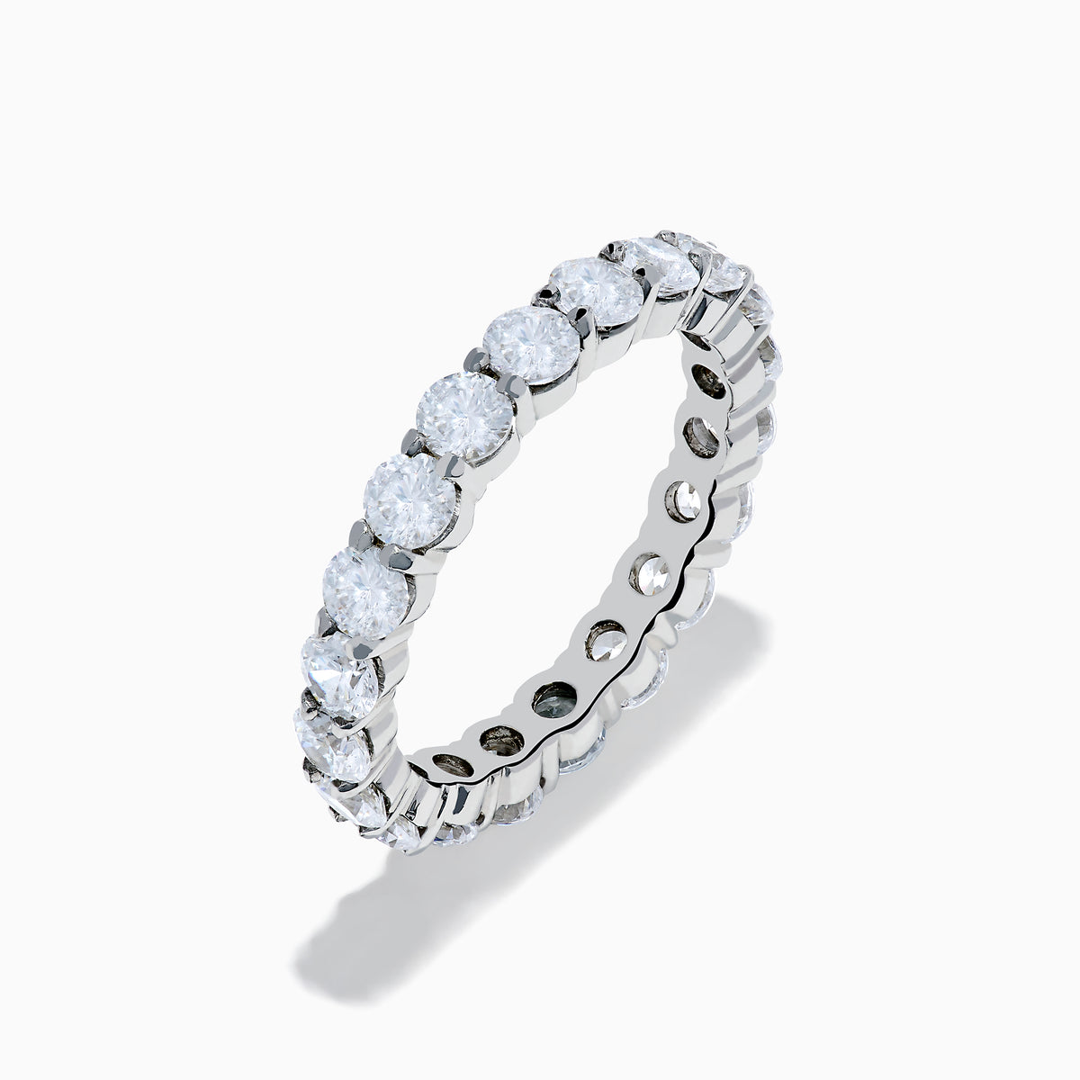 The 14K White Gold Prong Set Diamond Eternity Band, 3.00 TCW, features round diamonds encircling the band and is shown on a plain white background.