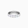 The 14K White Gold Prong Set Diamond Eternity Band, 4.00 TCW, showcases a seamless row of round white diamonds in prong settings, crafted in stunning 14K white gold and presented on a plain white background.