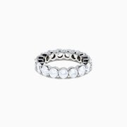 The 14K White Gold Prong Set Diamond Eternity Band, 4.00 TCW, showcases a seamless row of round white diamonds in prong settings, crafted in stunning 14K white gold and presented on a plain white background.