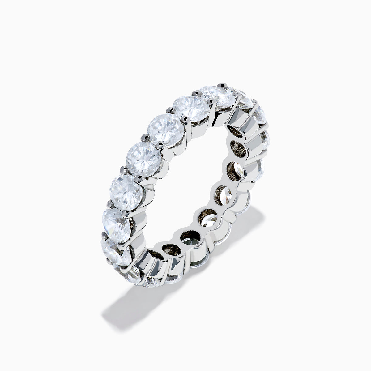 The 14K White Gold Prong Set Diamond Eternity Band, 4.00 TCW, showcases a seamless row of round white diamonds in prong settings, crafted in stunning 14K white gold and presented on a plain white background.
