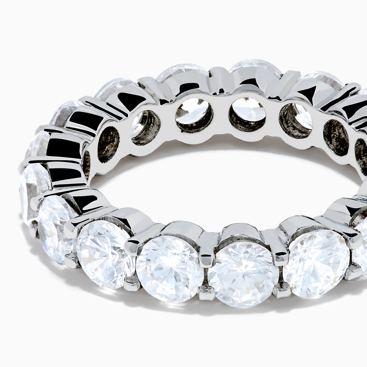 The 14K White Gold Prong Set Diamond Eternity Band, 4.00 TCW, showcases a seamless row of round white diamonds in prong settings, crafted in stunning 14K white gold and presented on a plain white background.
