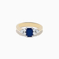 The Royale Bleu 14K Yellow & White Gold Blue Sapphire and Diamond Ring, 1.46 TCW, features a rectangular deep blue sapphire center with three round white diamonds on each side in a minimalist setting.