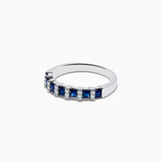 The Royale Bleu 14K White Gold Sapphire and Diamond Ring, 0.95 TCW, features alternating blue sapphire and white diamond stones set in a row along the band, displayed against a plain white background.