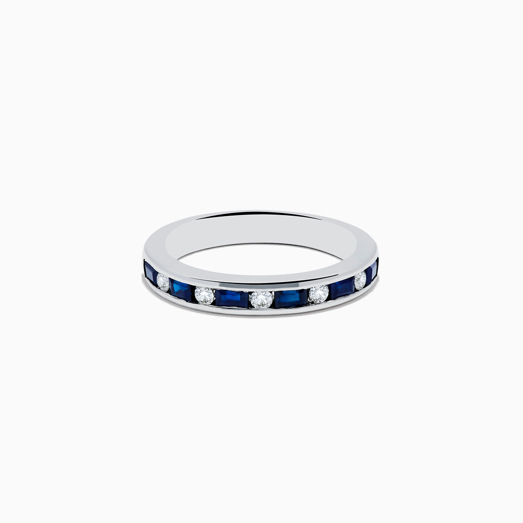 The 14K White Gold Channel-Set Blue Sapphire and Diamond Band 0.71 TCW features alternating blue sapphires and round white diamonds in a channel setting, shown against a plain white background.