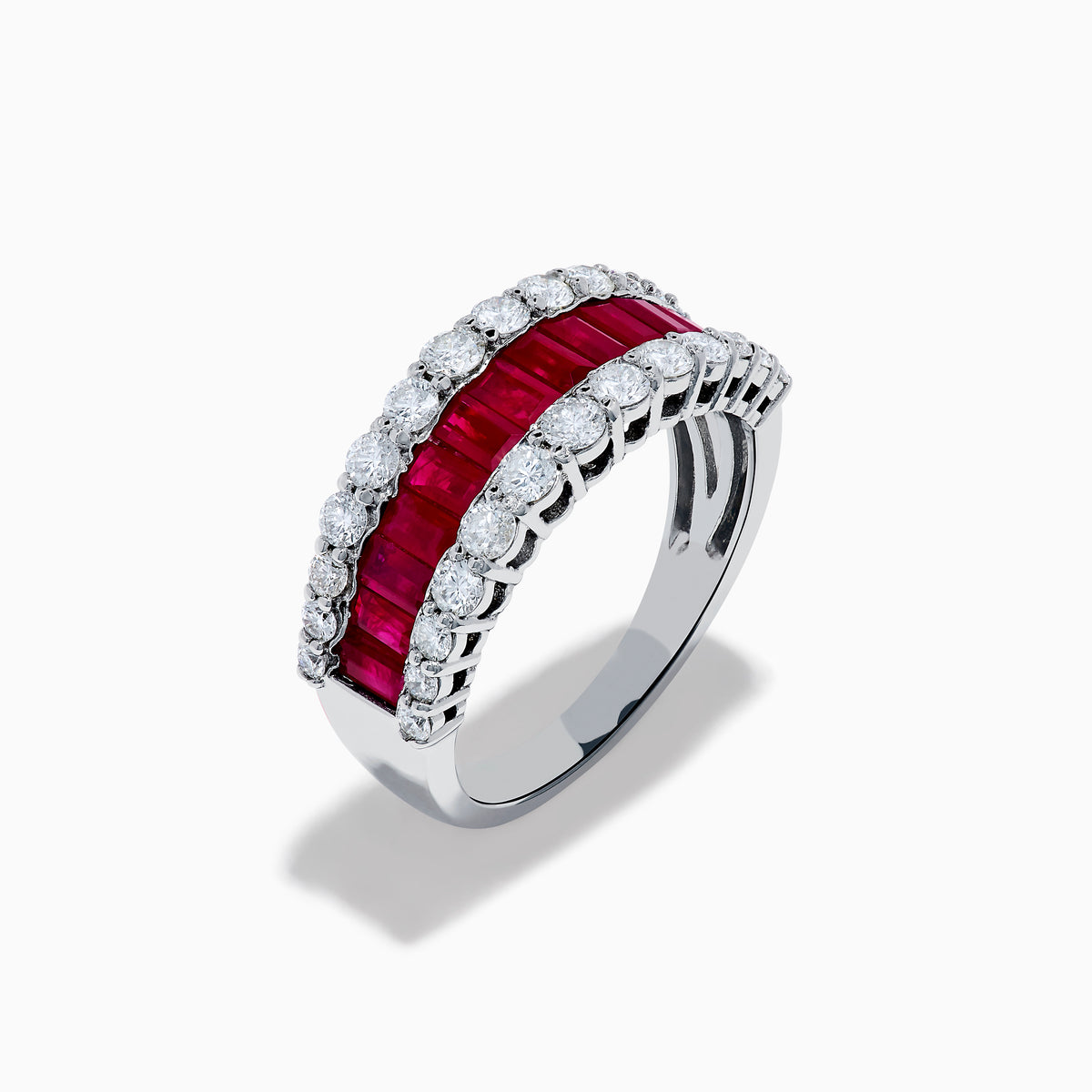 The Ruby Royale 14K White Gold Ruby and Diamond Wide Band showcases a central row of rectangular rubies flanked by sparkling round diamonds, all elegantly set in white gold against a plain white background.