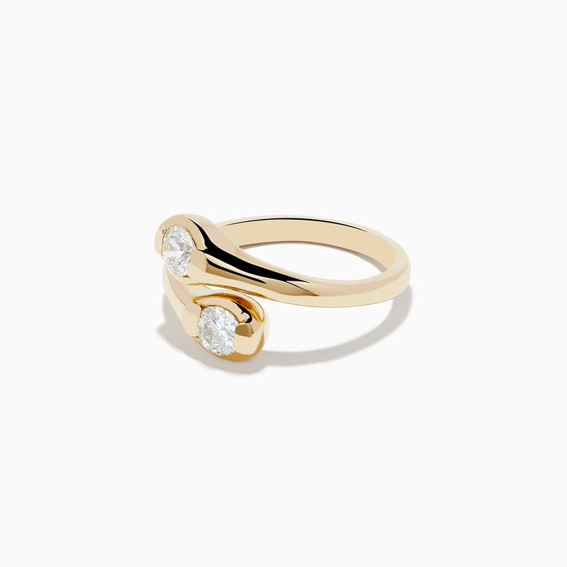 The DOro 14K Yellow Gold Two-of-Us Diamond Ring, 0.59 TCW, showcases two oval-cut diamonds on each end of a bypass band that elegantly curves around the stones.