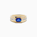 Mens 14K yellow gold ring with a large oval blue tanzanite center stone, accented by rows of small round white diamonds on each side.