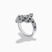 A stunning 14K White Gold Panther Ring adorned with white and black diamonds and vivid emerald eyes, shown against a white background.